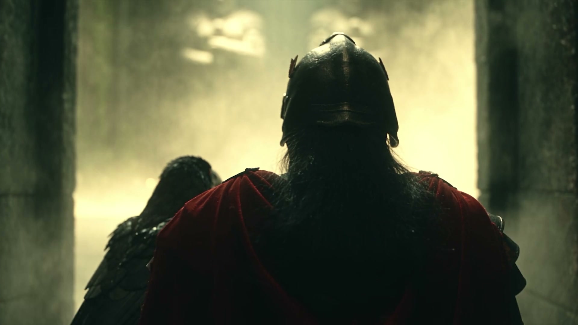 Knight in a red cloak walks beside a raven through mist